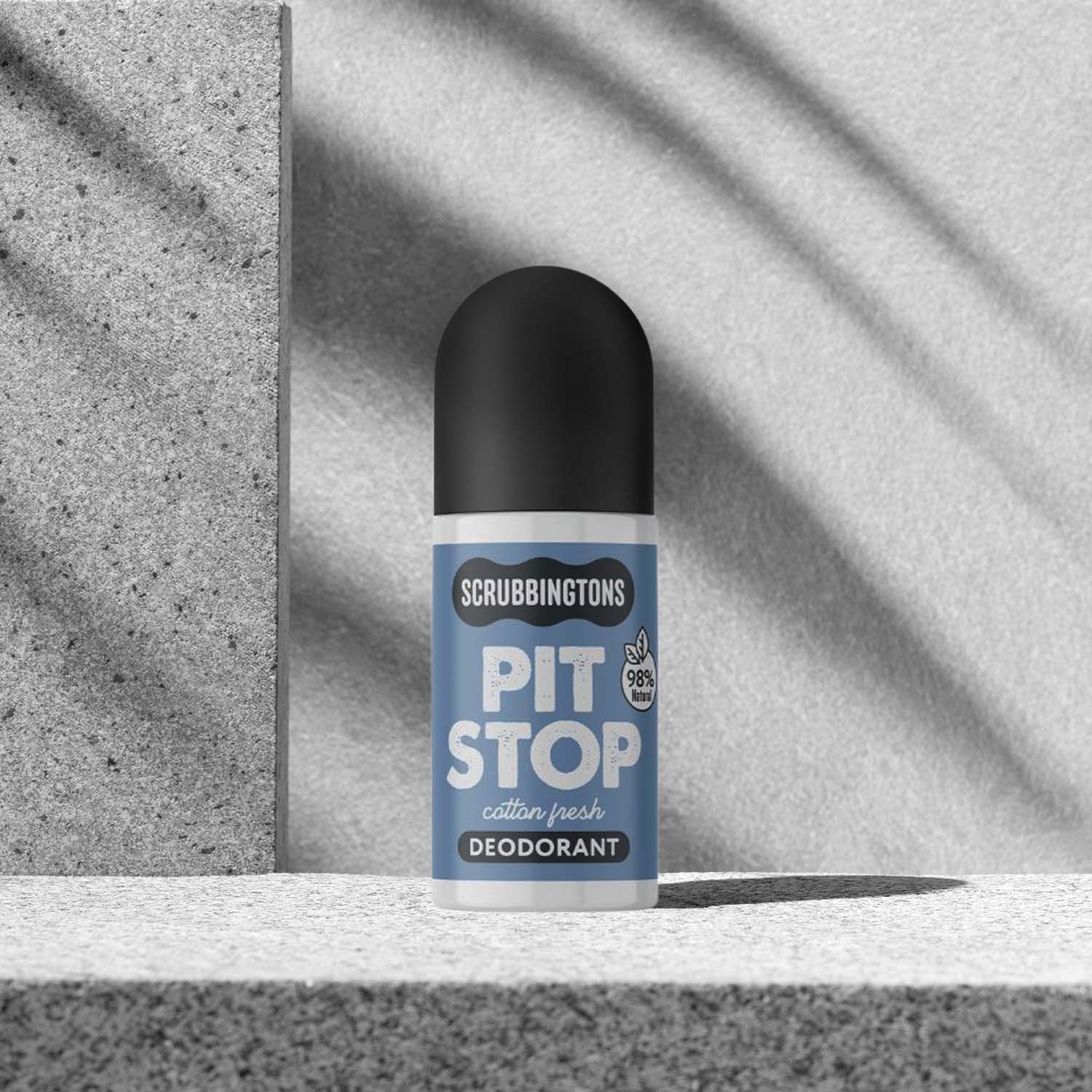 Deodorant roll-on with Scrubbingtons branding on a grey background